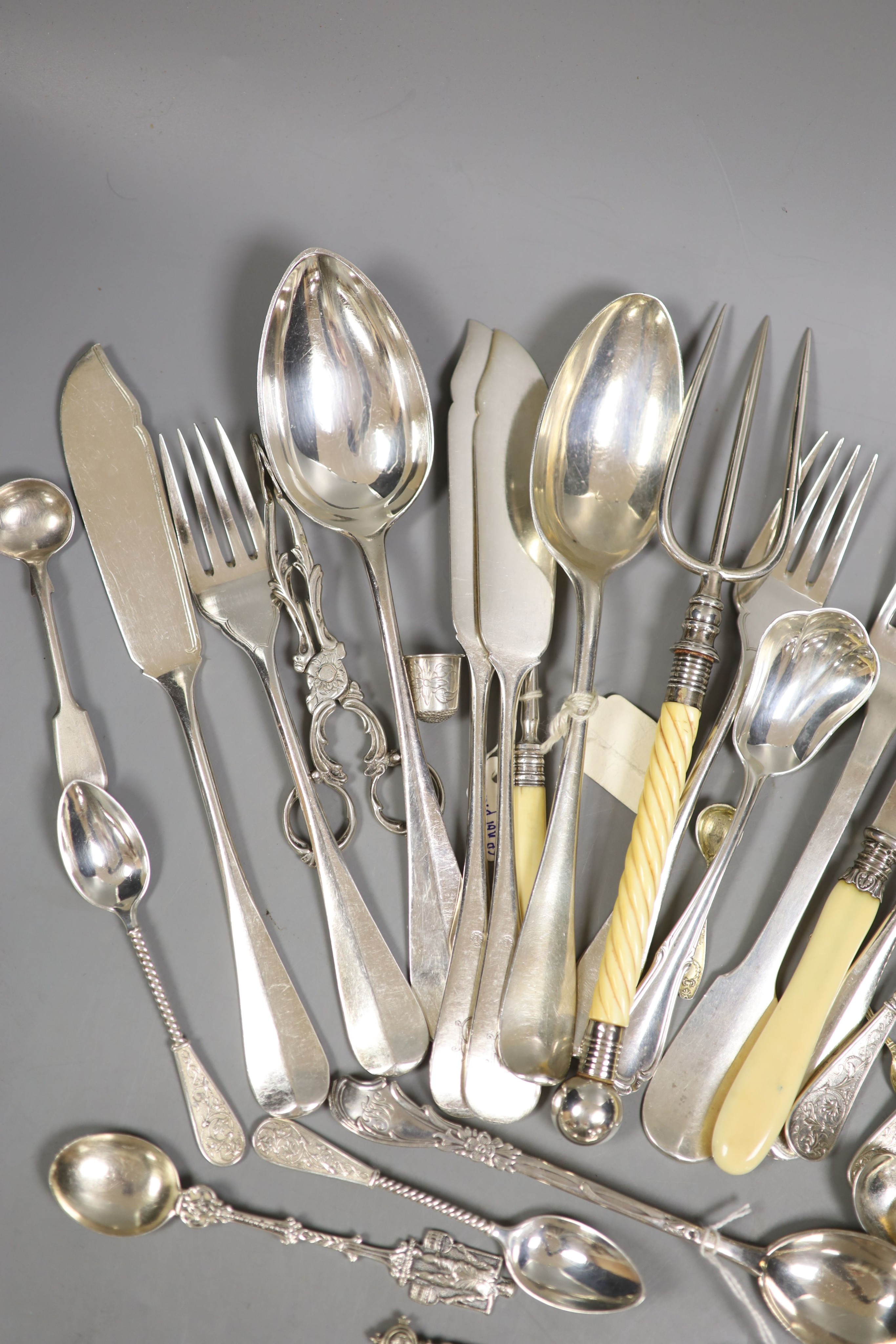 A pair of German 800 gilt white metal salts and a quantity of continental white metal flatware including French, Dutch and Austro-Hungarian, weighable white metal 13oz and a group of plated flatware.